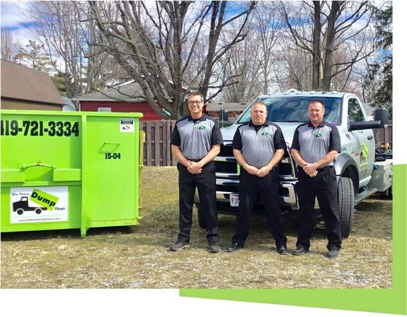 Three individuals in uniforms posing in front of a pick-up truck and a green dumpster rental franchise with contact information displayed.